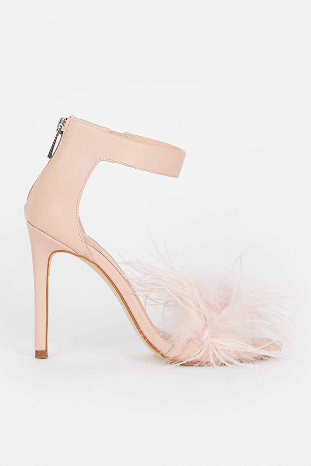 Heels with store feathers on front